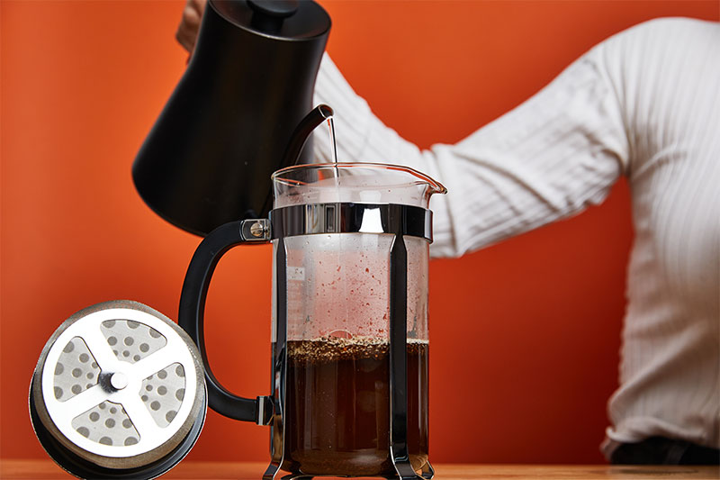 https://coffeebros.com/cdn/shop/files/French-press-recipe-step-3-warm-up-water-and-pour-into-the-french-press.jpg?v=1679331356&width=1500